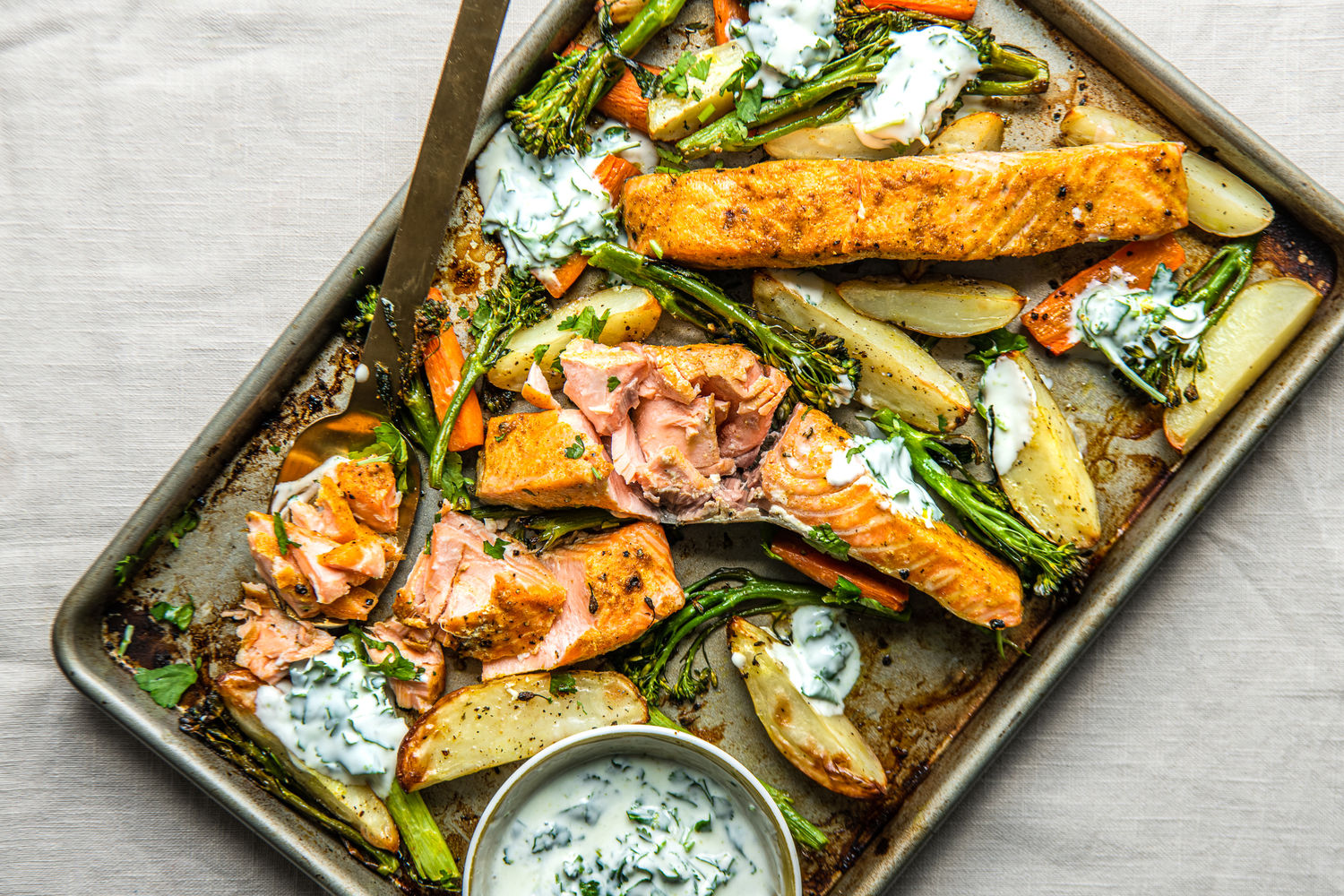 Spiced Salmon Traybake with Carrots, Potatoes and Herby Lime Yoghurt | The Doctor's Kitchen